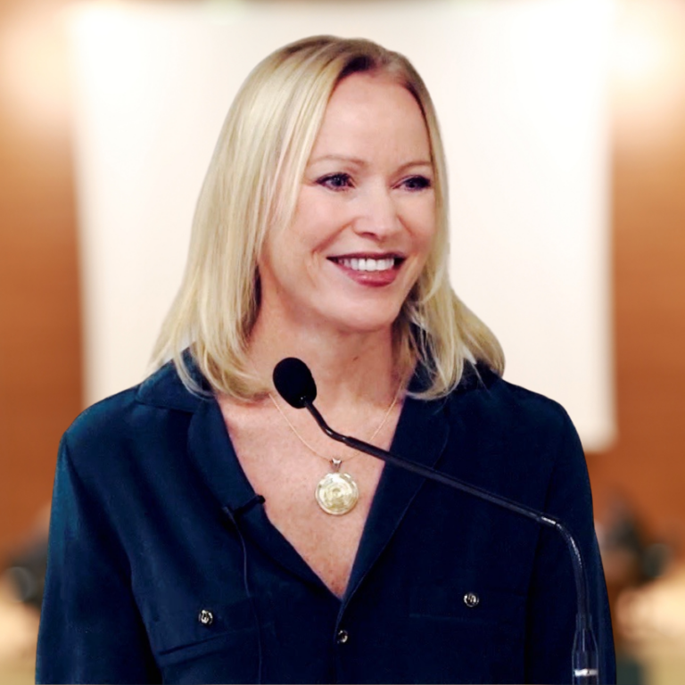 Elizabeth Cantey speaking at a microphone